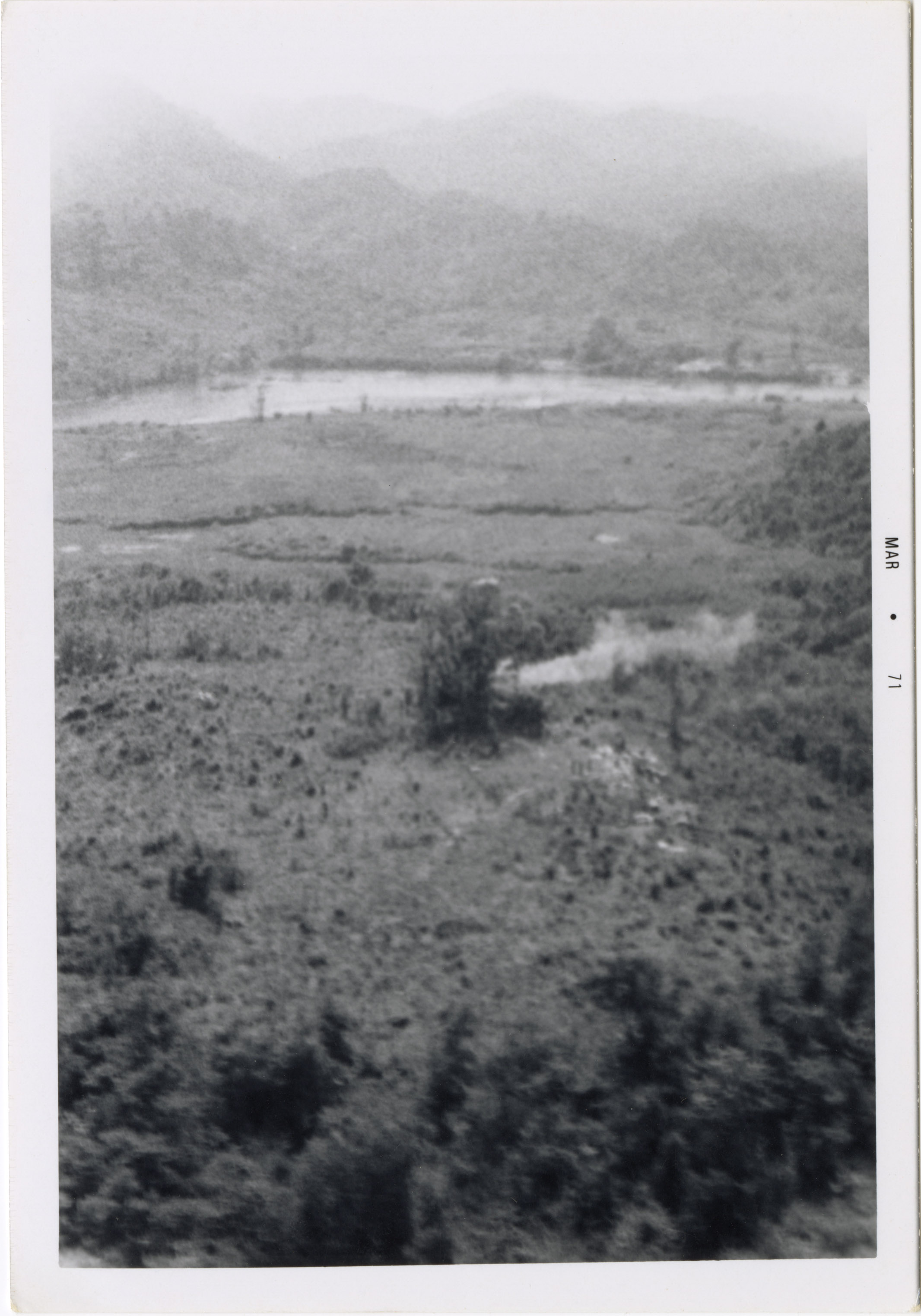 Vietnamese countryside with a rivers and mountains in the distance.