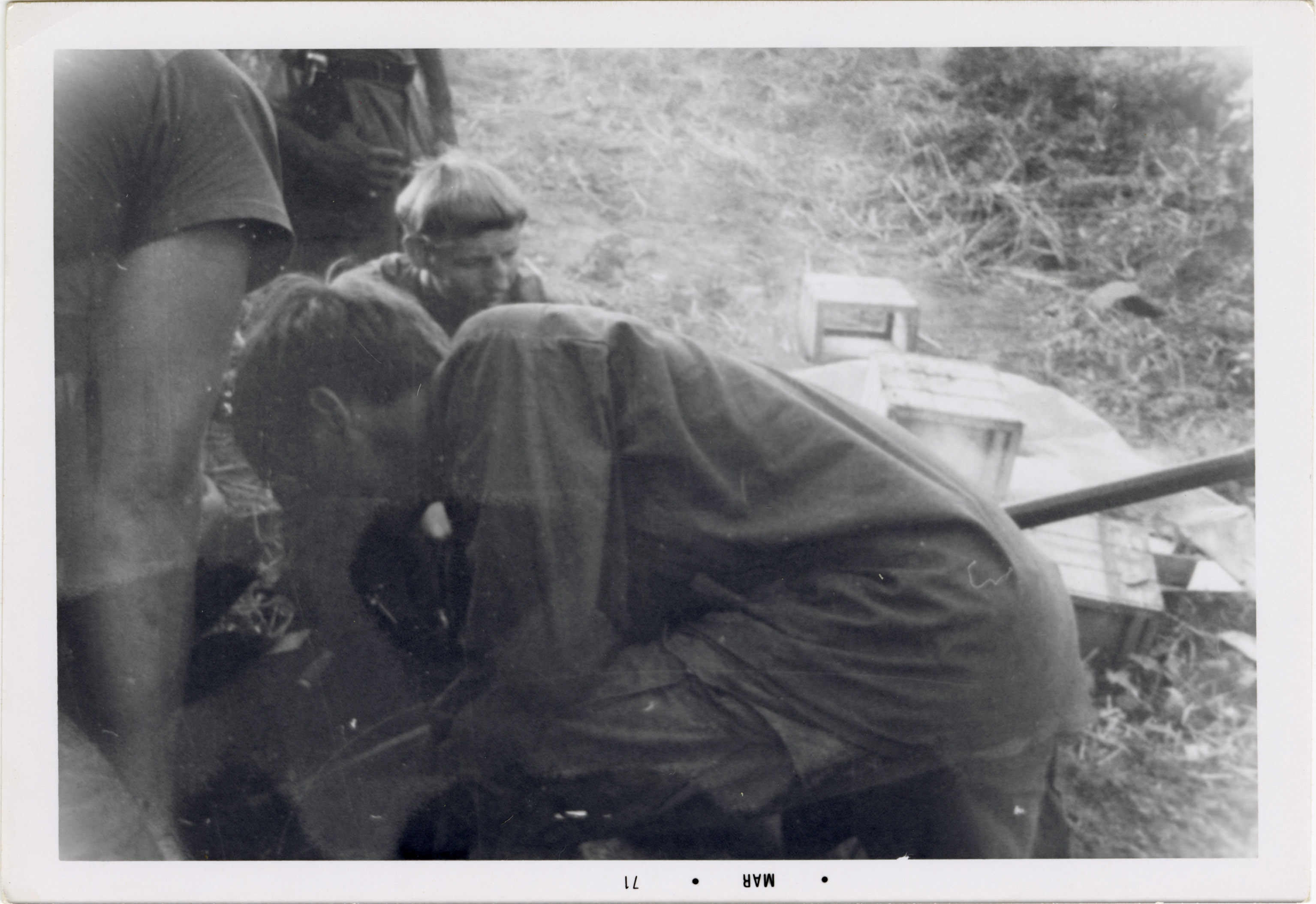 Soldiers are working together on some equipment.